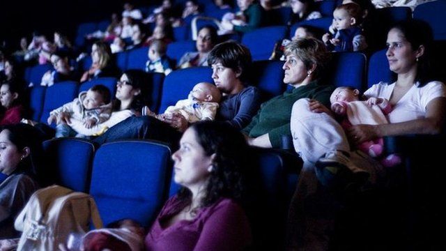 Mothers and their babies at a film screening