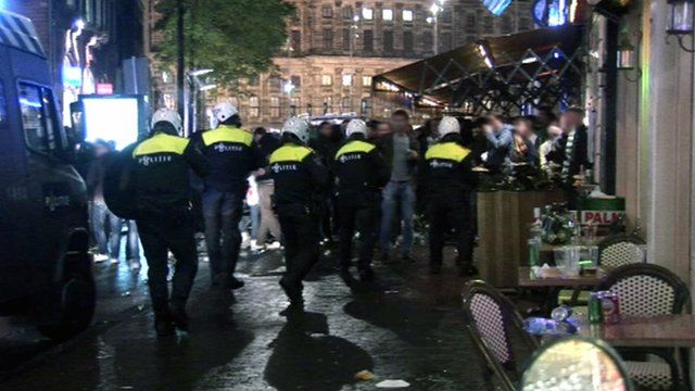 Dutch police and football fans in Amsterdam