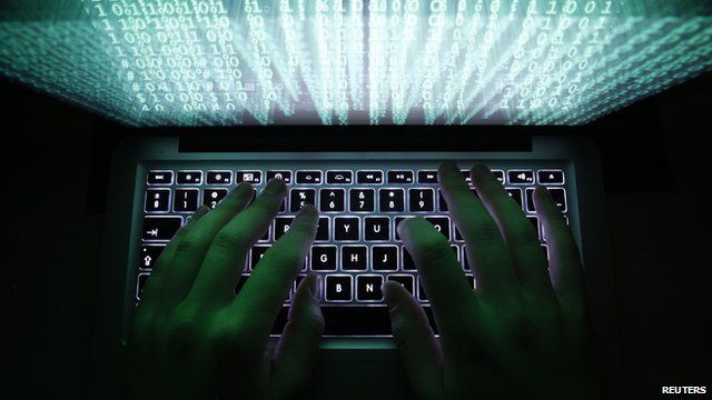 Person typing computer code