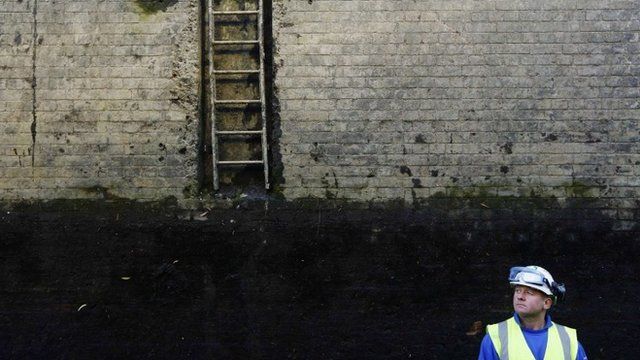 Workman at bottom of Camden Lock
