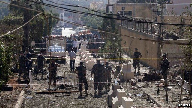 Lebanese Army soldiers inspect the site of the explosion