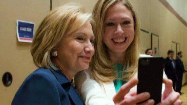 Hillary and Chelsea Clinton taking a "selfie"