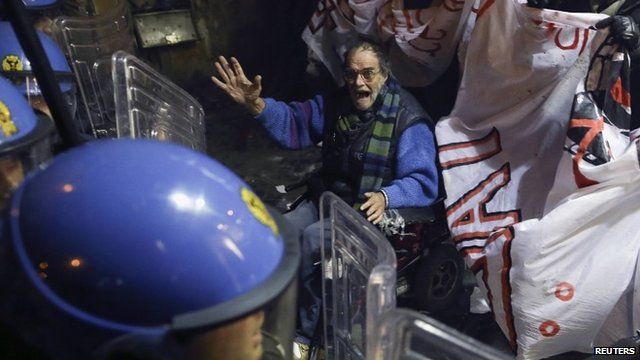Protester and riot police in Rome