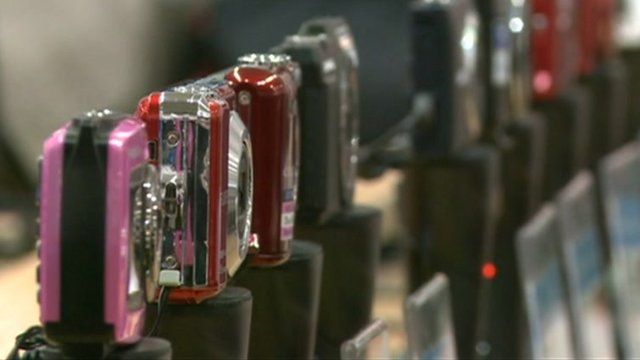 Cameras lined up in shop