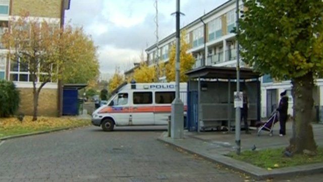 Police van outside flats in Brixton