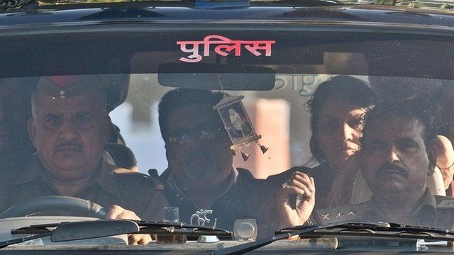 Rajesh Talwar (2nd L) and his wife Nupur Talwar (2R) arrive at Dasna Prison