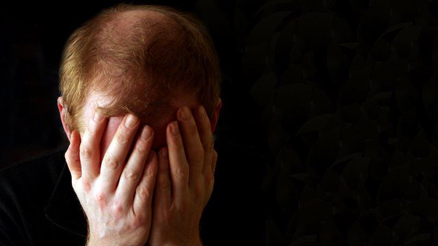 Man with head in his hands