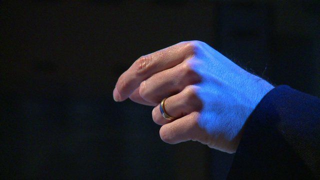 A hand controlling a ultrasound powered device