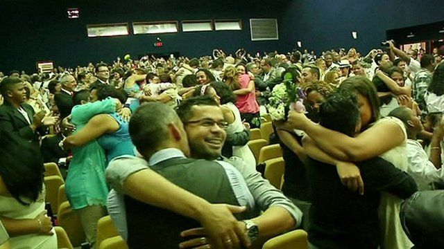 Couples embrace as they are declared officially married