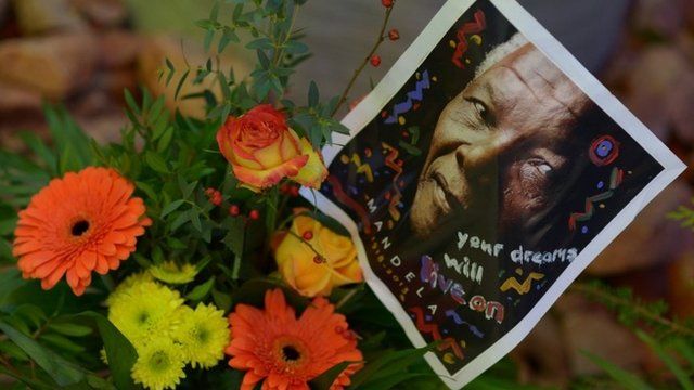 Flowers and a photo of former South African President Nelson Mandela