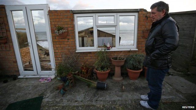 Steve Connelly looks at the remains of his home
