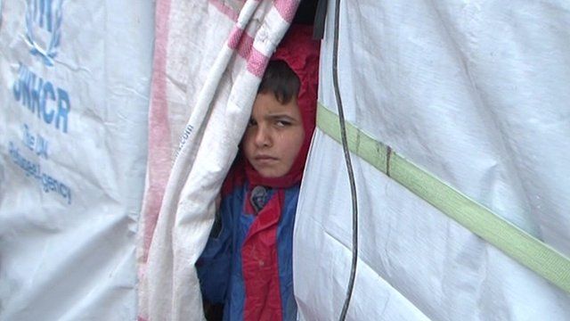 Child in tented settlement