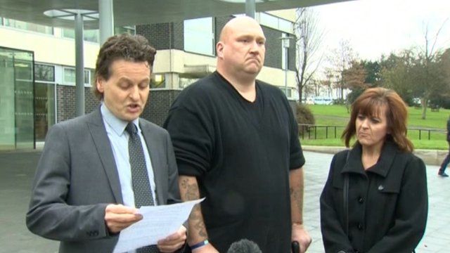 Nigel Verdon, centre, with his wife and solicitor outside Mold Crown Court