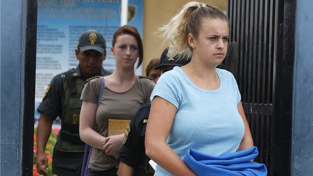 Michaella McCollum and Melissa Reid arrive for a court hearing in Lima, Peru