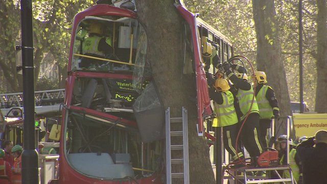 A double-decker bus which hit a tree in south London