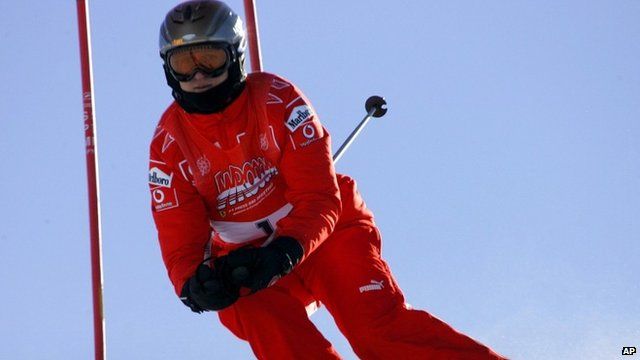 Jan. 13, 2006 file photo, Ferrari driver Michael Schumacher of Germany speeds down a course in Madonna di Campiglio, Italy.
