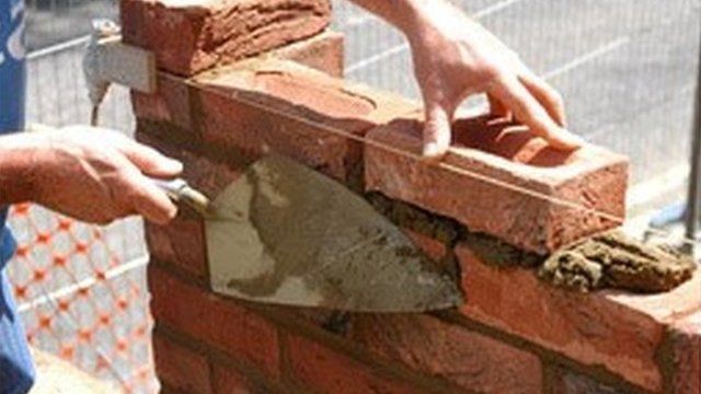 Man building with bricks