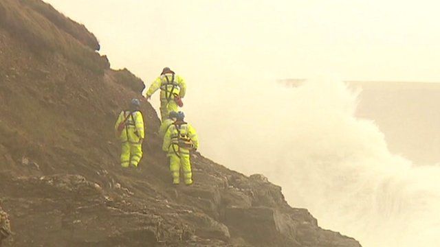 Rescuers on cliff face