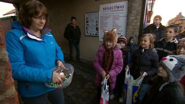 Children scrambling for sweets