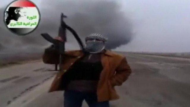 Still of man with gun from video posted online