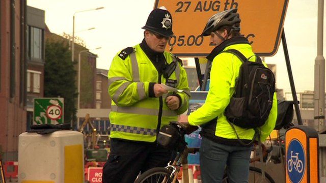 Police officer speaking to a cyclist
