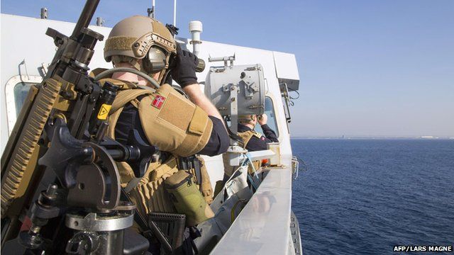 A photo of Norwegian naval forces as the ship secures the port of the Syrian city of Lakakia during an operation to move chemical agents from Syria