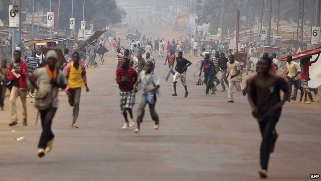 Looters run for cover as they hear rifle shots
