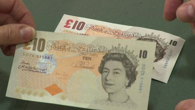 A counterfeit £10 against a real one