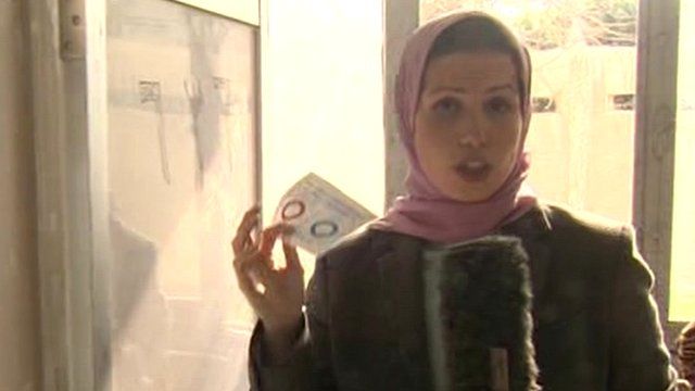 Sally Nabil with a voting paper in an Alexandria polling station