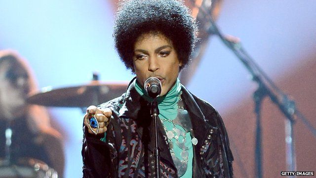 Musician Prince performs onstage during the 2013 Billboard Music Awards