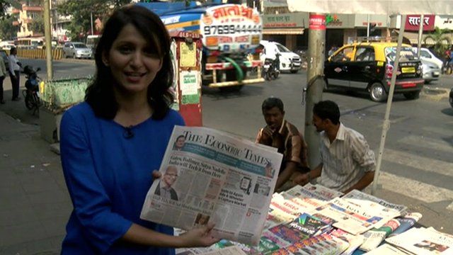 Yogita Limaye holds newspaper