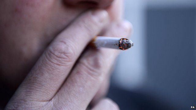 A man smoking a cigarette