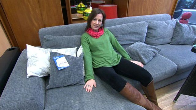 Sarah Falkland on the donated sofa