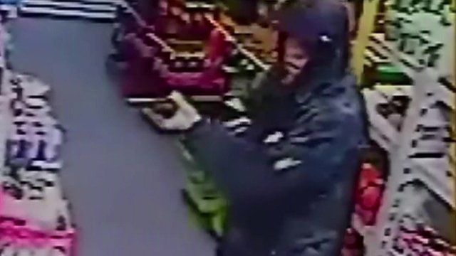 Suspect with gun