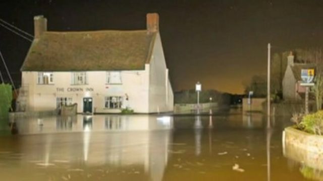The Crown Inn surrounded by flood water