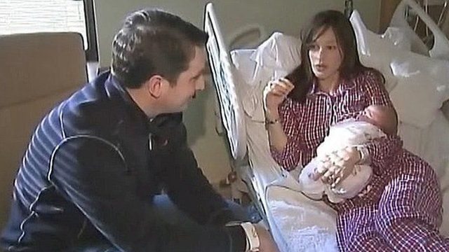 Polly McCourt (right), husband Cian and their newborn daughter