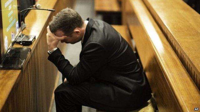 Oscar Pistorius with head in hands