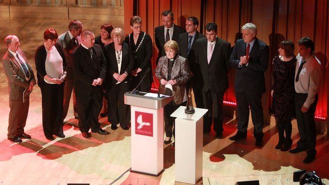 Representatives of Machynlleth joined April Jones' parents on stage for the award