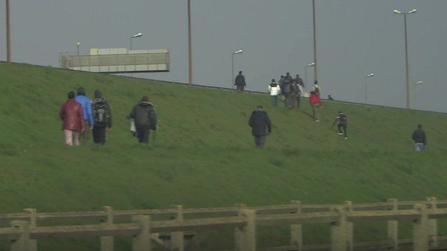 Illegal migrants trying to board UK-bound lorries in Calais