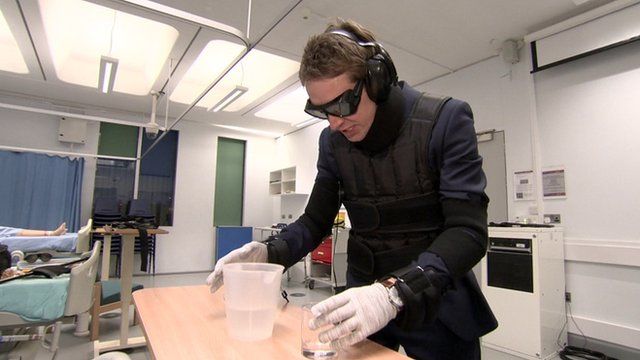 BBC London TV reporter tries on an 'age simulation suit'