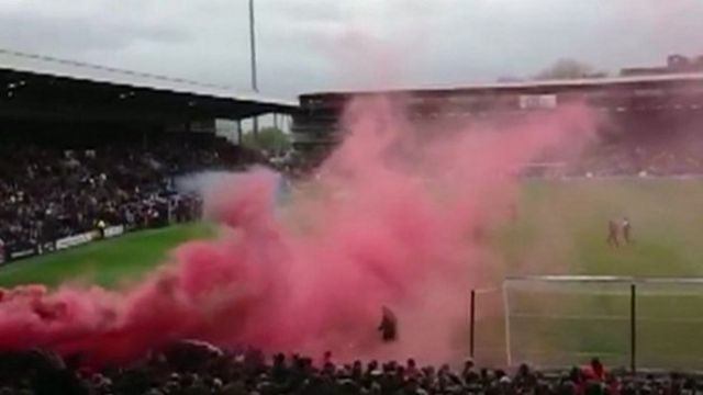 Smoke from smoke grenade at football stadium