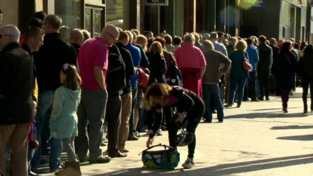 Hundreds of people queued outside the Visit Belfast Welcome Centre for free tickets