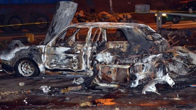 Burnt car at scene of Abuja bombing