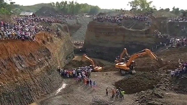 Mechanical diggers at the sight of the mine collapse in Colombia