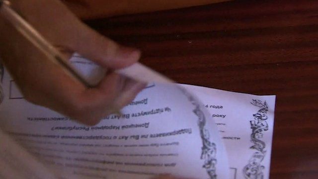 Person with two polling cards