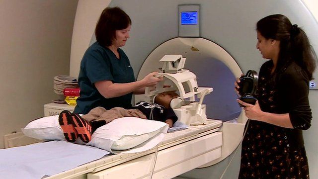 Child being prepared for a brain scan