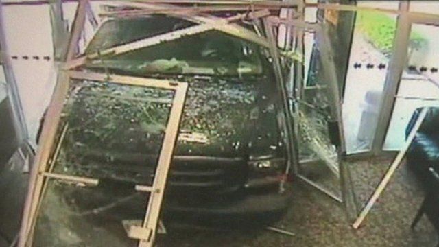 The truck smashing through the TV station's entrance