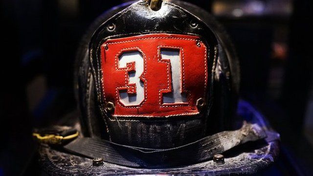 Surviving firefighter Dan Potter's fire helmet, which he used at Ground Zero on September 11, is viewed during a tour the National September 11 Memorial Museum