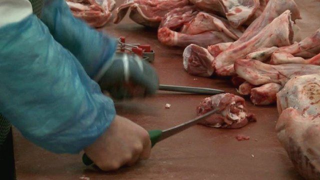 Meat being cut