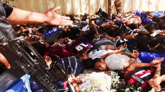 Image posted on a militant website on Saturday, June 14, 2014 appears to show militants from the Islamic State of Iraq and the Levant (ISIL) with captured Iraqi soldiers wearing plain clothes